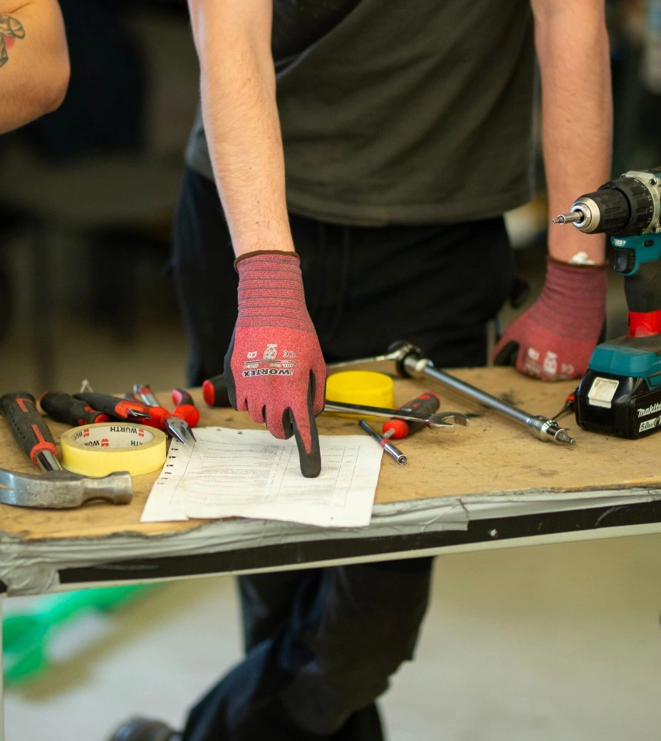 Hand pointing at a schematic