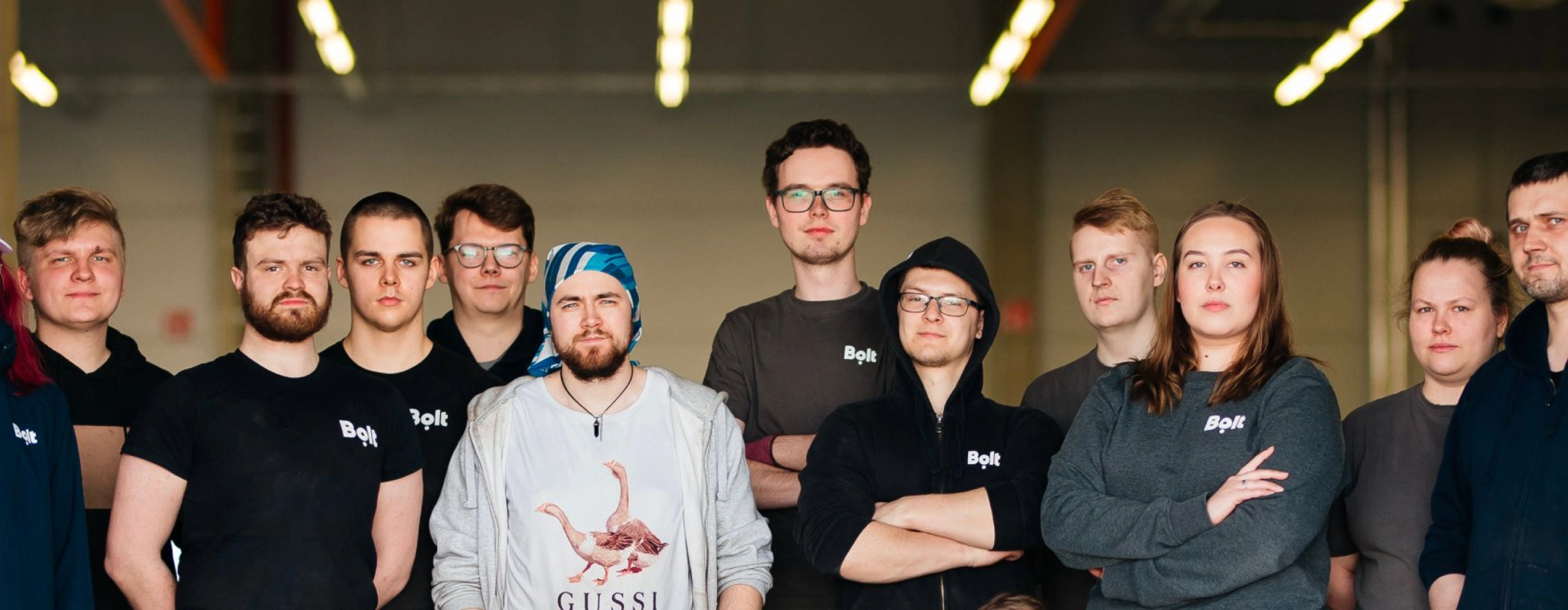 Bolt warehouse workers in a warehouse with scooters